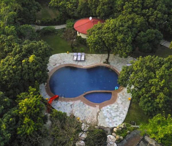 Outdoor swimming pool at La Perle River Resort